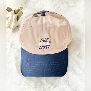 New with tags “TAKE ME TO THE LAKE!” HAT Tan with Navy bill. Sun and hat on logo